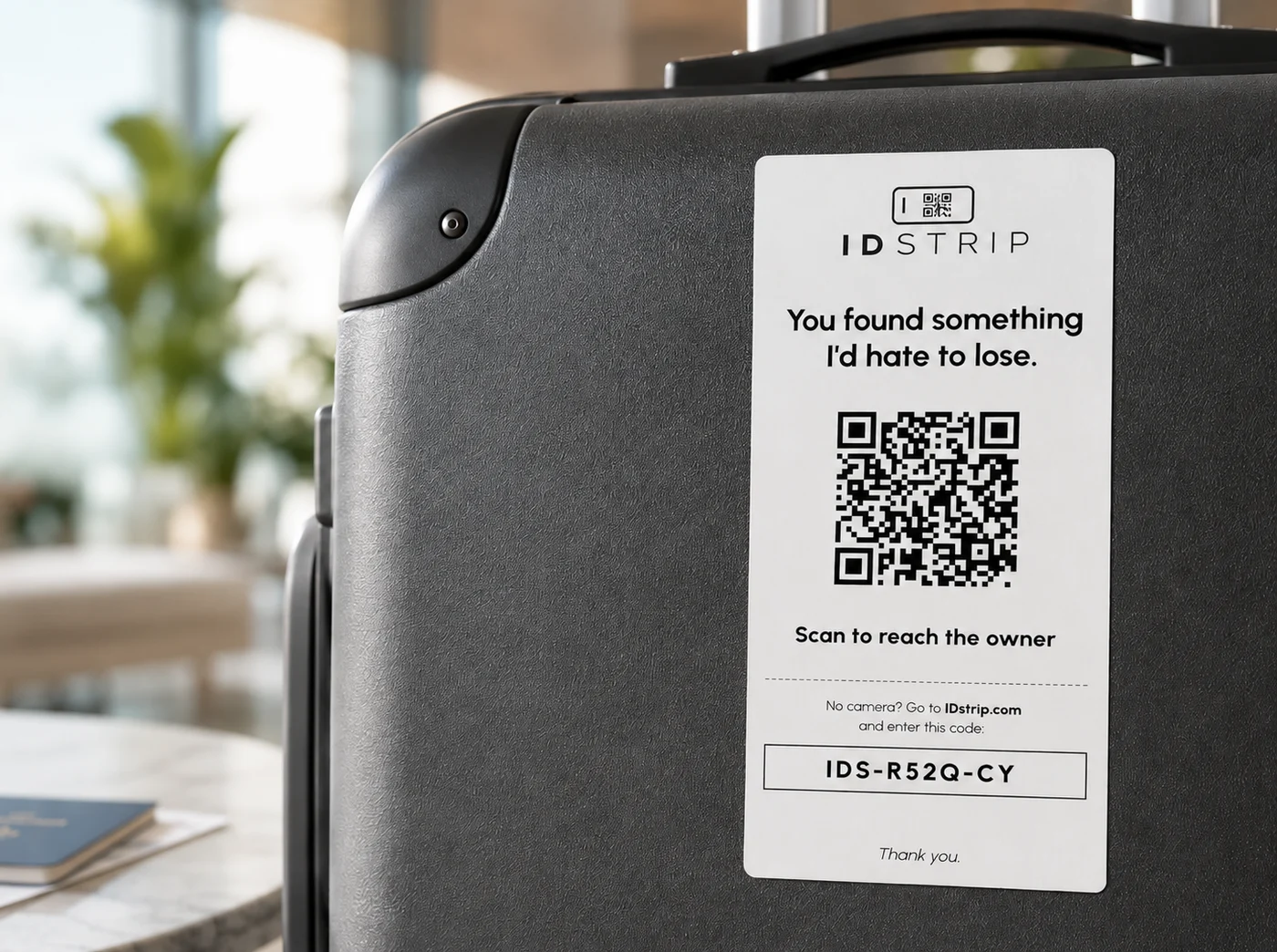 IDstrip lost-and-found tag on a suitcase