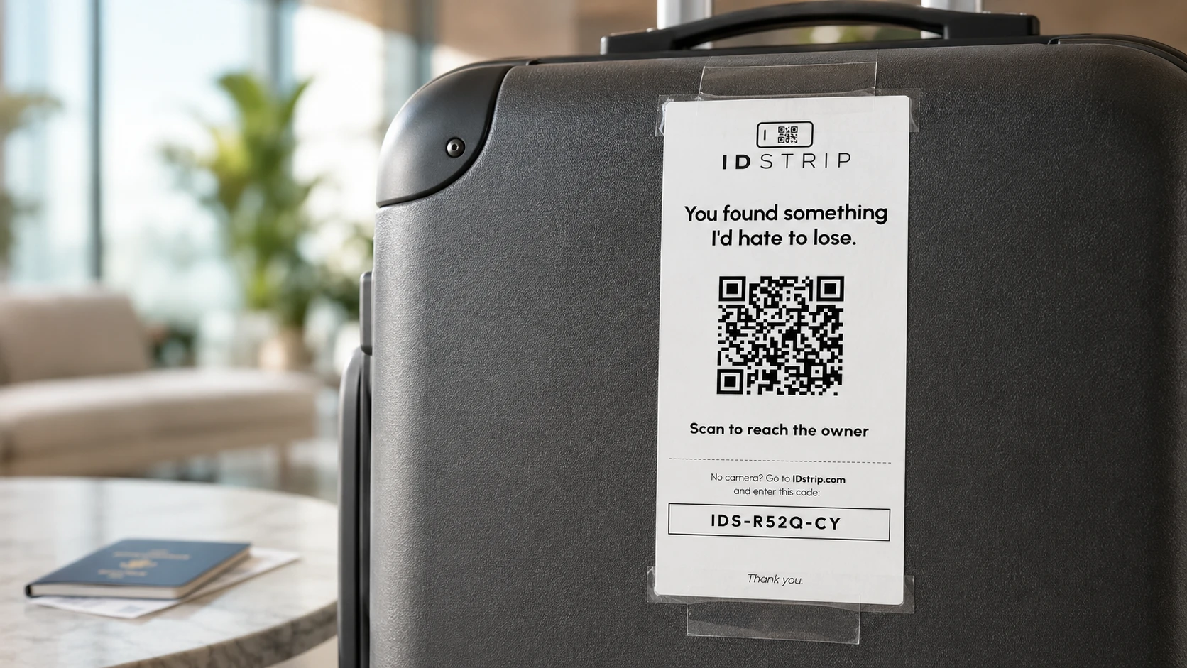 IDstrip lost-and-found tag on a suitcase